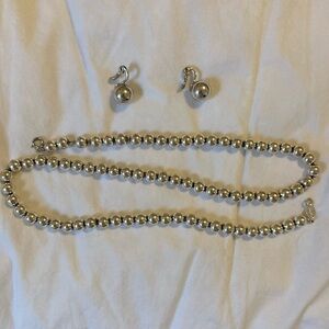 Necklace and clip on earrings set.  Silver color.  Heavy beads.
